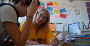 A.P. Teacher Susan Stokley volunteers valuable time to helping students connect with the writing process.  photo by Rebecca Holt