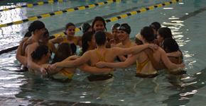 The TJ girls swimming gets amped up for their meet against Englewood. Photo by Tori Wallace