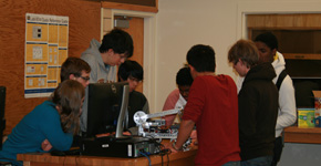 Robotics students continue working together to design new robots. Photo courtesy of Chris