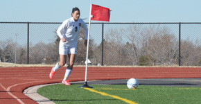 Senior Braelah McGinnis kicks a corner kick for the Lady Spartans Soccer team. Photo by Clayton Bridges. 